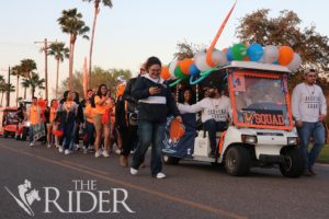Students walk during the Homecoming Golf Cart Parade last spring in Edinburg. The parade started at Unity Residence Hall and finished at the Fieldhouse. File Photos
