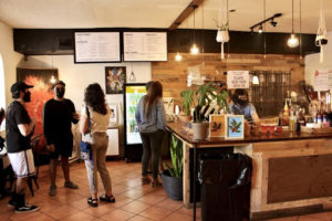 Customers wait in line to order coffee at Grind Coffee Co.’s fifth anniversary celebration. Jacqueline Wallace/The Rider Photo