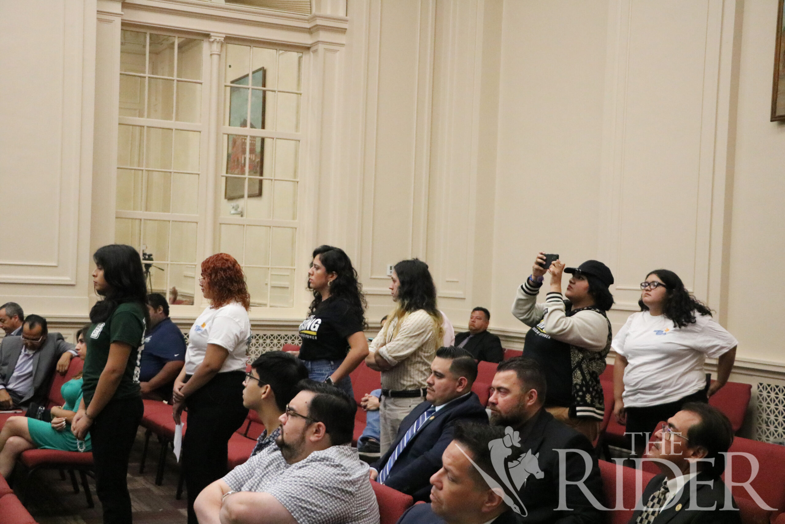 Brownsville residents stand in line to speak against the proposed increase in bus fares Tuesday in the City Hall. The resolution was passed 5-2 and takes effect Oct. 1. Carlos Castañeda/THE RIDER