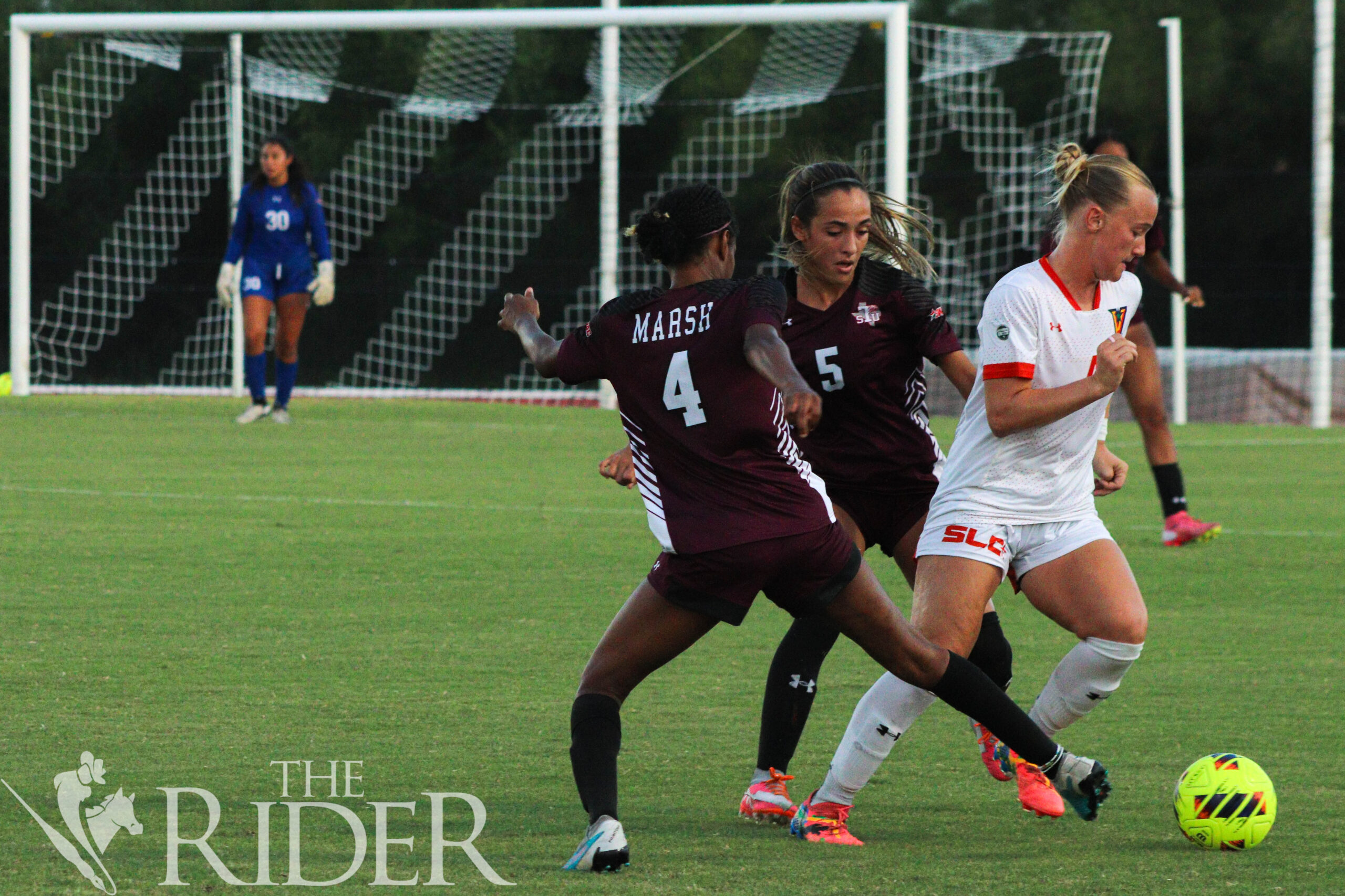 Vaqueros senior midfielder Sam Maudsley weaves through Tigers senior midfielder Dejah Marsh (left) and sophomore forward Isabella Dillow during tonight’s match against Texas Southern University at the UTRGV Soccer and Track & Field Complex on the Edinburg campus. The Vaqueros lost 1-0 to the Tigers. Abigail Ollave/THE RIDER