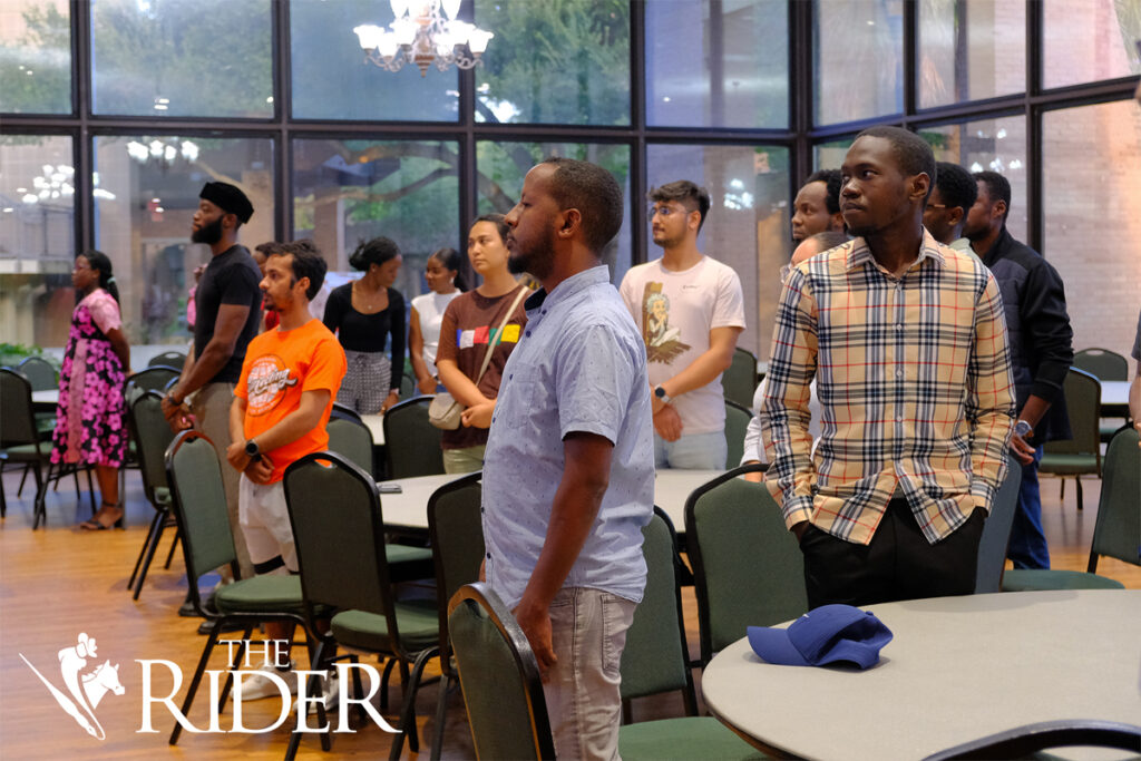 Attendees stand up for the Nigerian, South African, Jamaican, Kenyan and United States national anthems during the ASA Fall Social 2024 Saturday in the University Ballroom on the Edinburg campus. Angel Ballesteros/THE RIDER