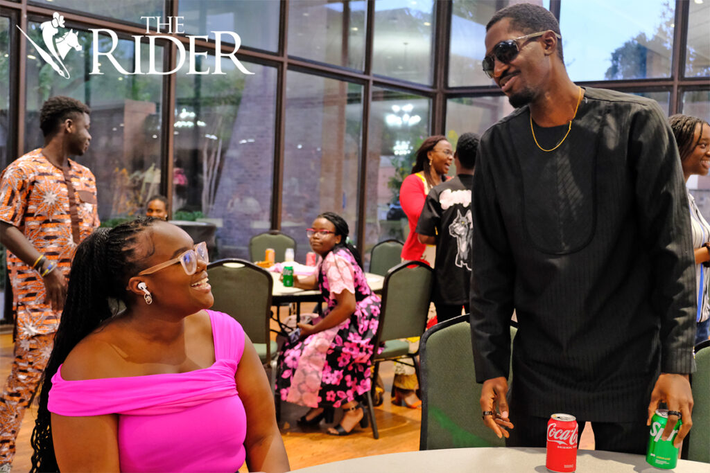 Olivia Mackey, a second-year student in the UTRGV School of Podiatric Medicine (left), and computer science graduate student Kwabena Aboagye-Otchere chat during the ASA Fall Social 2024 Saturday evening in the University Ballroom on the Edinburg campus. Angel Ballesteros/THE RIDER