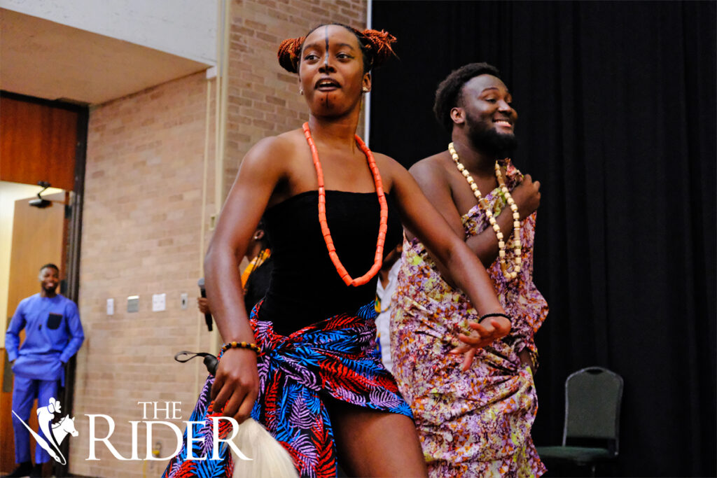 Ekemini Akpabio, social media coordinator of the African Students Association (left), and member Timi Gbadamosi participate in a fashion show during the ASA Fall Social 2024 Saturday in the University Ballroom on the Edinburg campus. Angel Ballesteros/THE RIDER