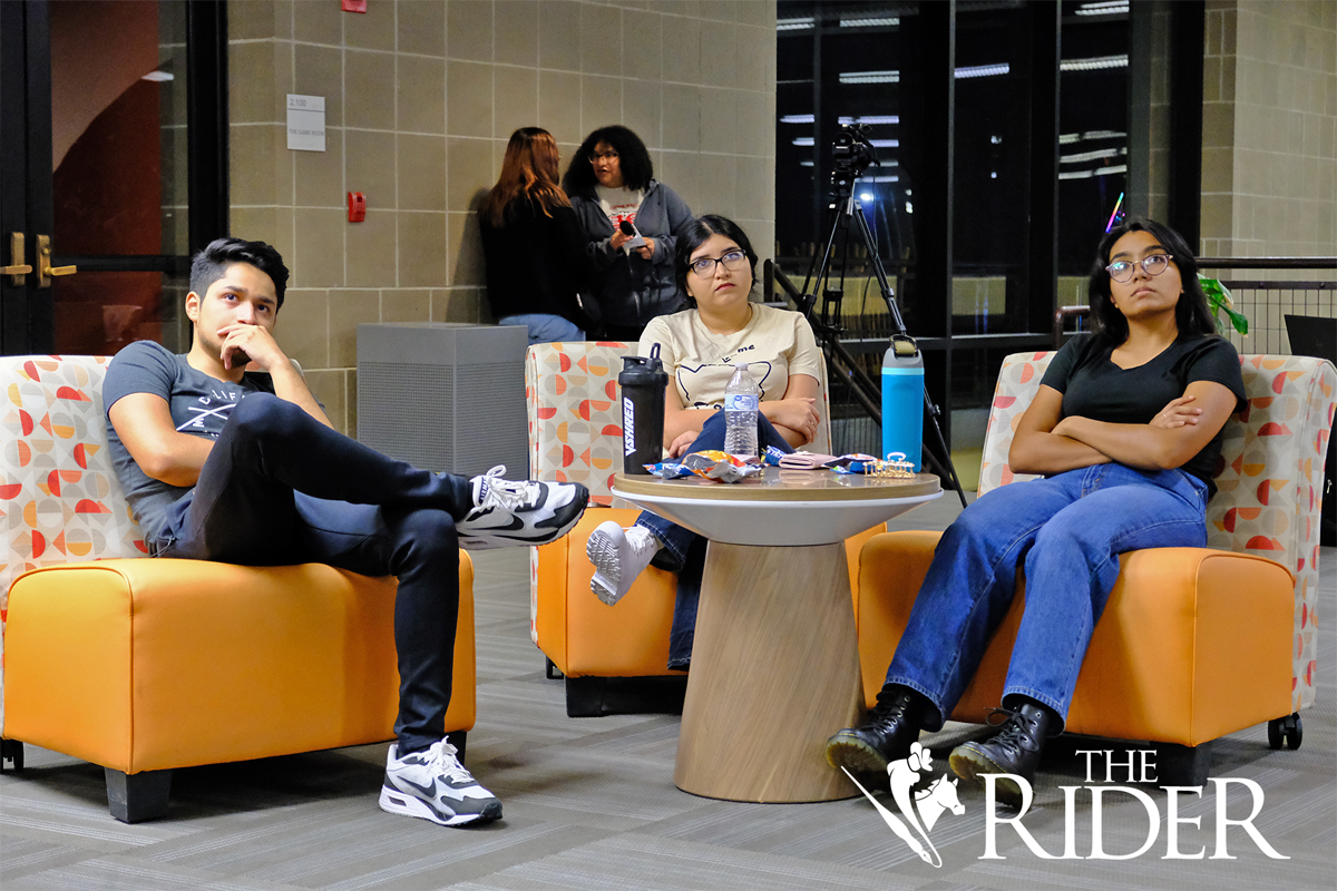 Accounting junior Emilio Oviedo (from left), criminal justice junior Ashley Ramirez and sustainable agriculture and food systems junior Aurora Acevedo watch the presidential debate Tuesday evening in the Student Union on the Edinburg campus. Angel Ballesteros/THE RIDER