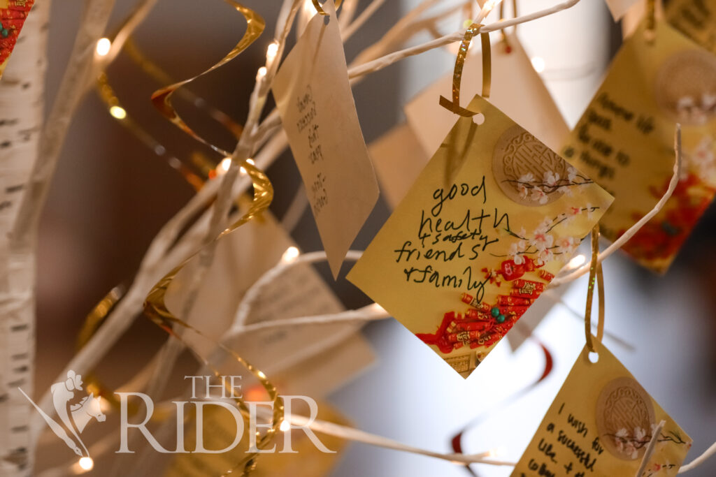 Brownsville students write down their wishes on a paper offering for good fortune Wednesday in the PlainsCapital Bank El Gran Sal贸n on the Brownsville campus. The Lunar New Year event was hosted by International Student Services. Mykel Del Angel/THE RIDER