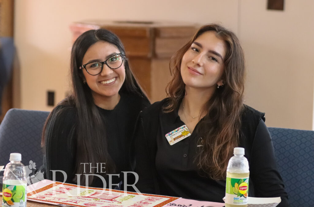 Psychology and marketing junior Itzel Medina (left) and international business junior Erika Lopez-Dieckmann enjoy the event Wednesday in the PlainsCapital Bank El Gran Sal贸n on the Brownsville campus. The celebration was hosted by International Student Services. Mykel Del Angel/THE RIDER