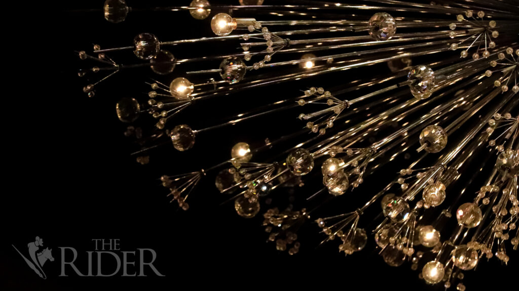 Texas Southmost College technicians dim the chandeliers as the concert begins. Mykel Del Angel/THE RIDER