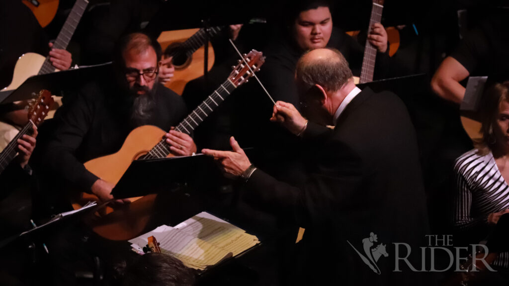 Music Professor Michael Quantz conducts the Cameron County Guitar Orchestra in the “Presence and Light” concert Saturday at the Texas Southmost College Performing Arts Center in Brownsville. Mykel Del Angel/THE RIDER