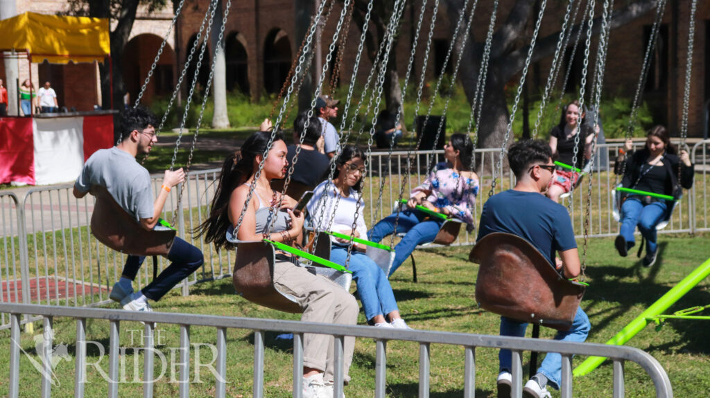 Students ride the swing carousel Wednesday at the Charreada on the Student Union lawn on the Brownsville campus. The event was hosted by UTRGV Student Activities, Campus Activities Board and the Student Union. Mykel Del Angel/THE RIDER
