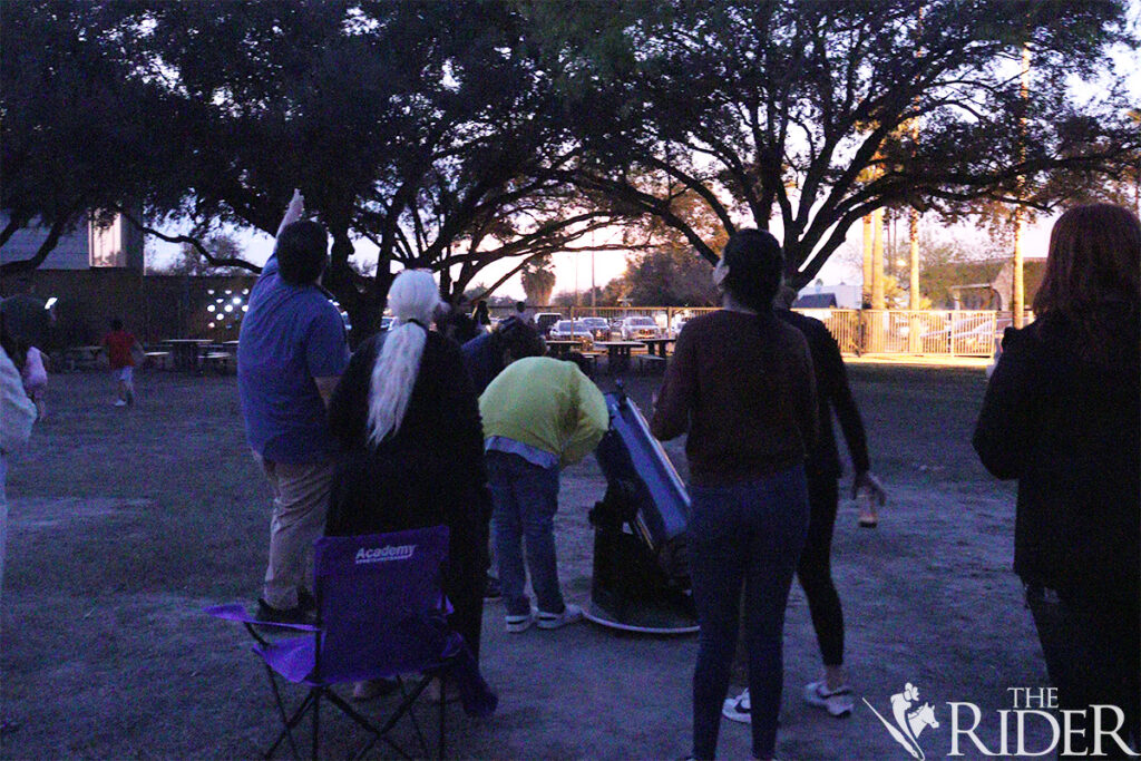 Attendees of the Mysterious Cosmos Family Fun Nights gather around Orion SkyQuest XT10 Plus with Center for Excellence in STEM Education of UTRGV to gaze at Venus at the International Museum Art & Science on Thursday. Attendees of the Center for Excellence in STEM Education for UTRGV gaze at Venus using an Orion SkyQuest XT10 Plus Thursday during the Mysterious Cosmos Family Fun Nights at the International Museum Art & Science in McAllen. Amara Cazares/THE RIDER