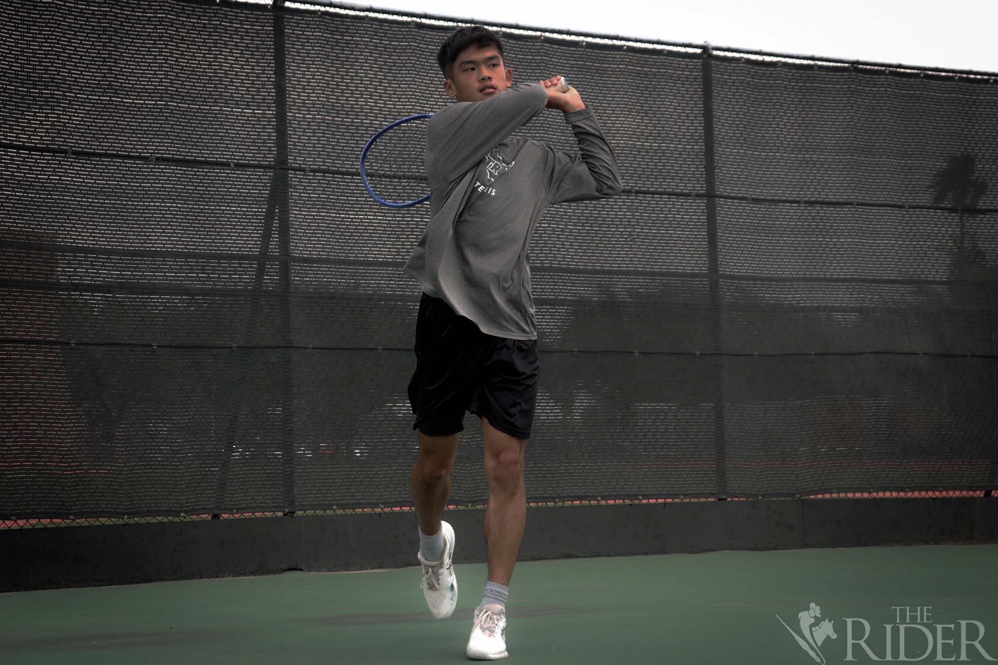 Sophomore Tsz Him “Micheal” Chan swings the ball back to the other side of the court during practice Wednesday in the UTRGV Orville I. Cox Tennis Center on the Edinburg campus. 