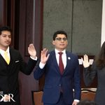 Kevin Flores (from left), Student Government Association external vice president; Ian Alfaro, SGA president; and Kayla Johnson, SGA internal vice president, raise their hands during the oath of office during the SGA inauguration Tuesday in Salón Cassia on the Brownsville campus  Valeria Tokun