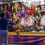 A student shoots a basketball, attempting to win a prize, during the 10 Year Celebration Thursday in Lot E-16 on the Edinburg campus.