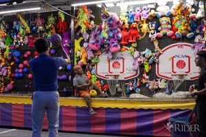 A student shoots a basketball, attempting to win a prize, during the 10 Year Celebration Thursday in Lot E-16 on the Edinburg campus.