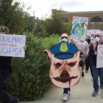 Protesters march around the UTRGV Student Union Quad in observance of National Protest Against Police Brutality Day