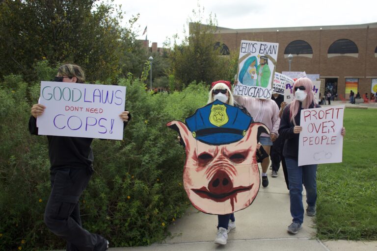 Protesters march around the UTRGV Student Union Quad in observance of National Protest Against Police Brutality Day
