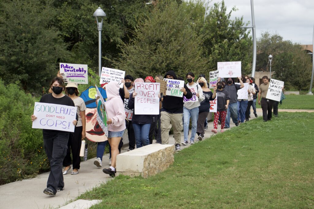Demonstrators advocate against ICE and police brutality Thursday afternoon at the Student Union Quad